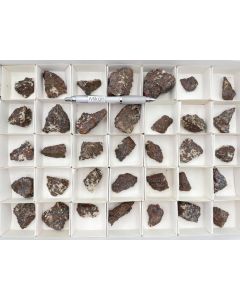 Zincite, willemite, calcite, etc.; small pieces, Franklin Mine, New Jersey, USA; 1 flat