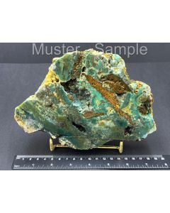 Fossilized (petrified) wood with Chalcedony; green; one side polished; with gold-colored metal stand; Indonesia; 1 piece
